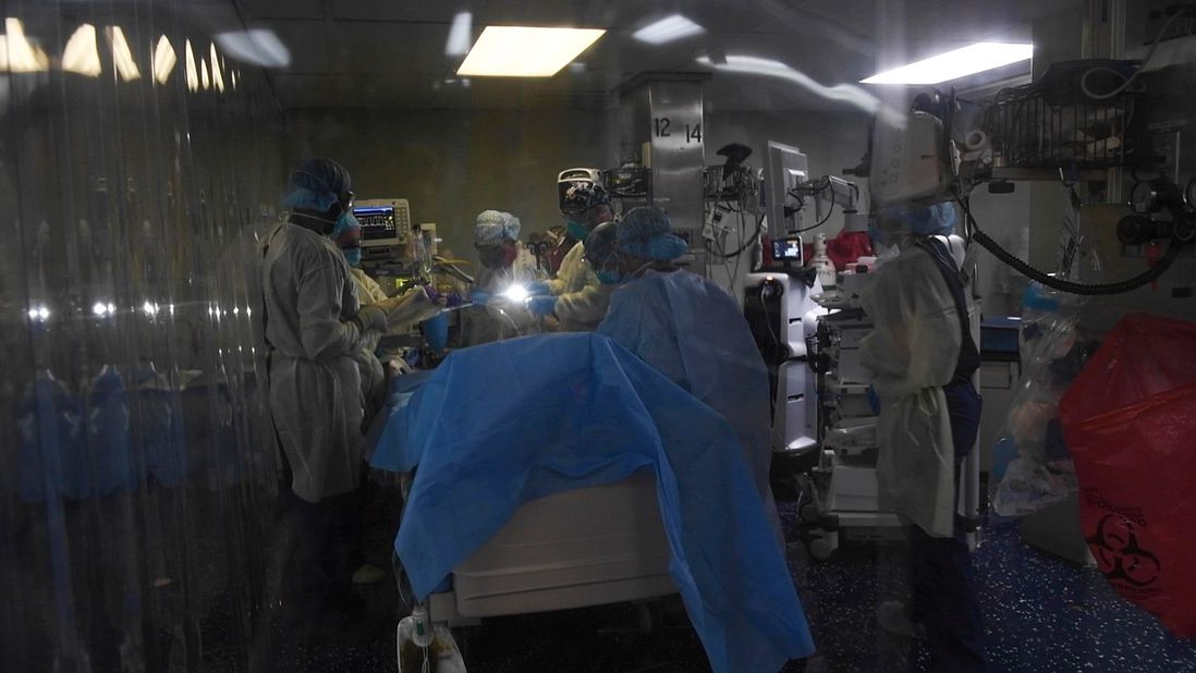 A handout photo made available by the US Navy shows Lt. j.g. Natasha McClinton, an operating room (OR) nurse, preparing a patient for a procedure in the intensive care unit (ICU) aboard the US hospital ship USNS Comfort (T-AH 20) in New York, New York, USA, 23 April 2020 (issued 26 April 2020), during the coronavirus disease (COVID-19) pandemic. Comfort, which cares for critical and non critical patients without regard to their COVID-19 status, is working with Javits New York Medical Station as an integrated system to relieve the New York City medical system.